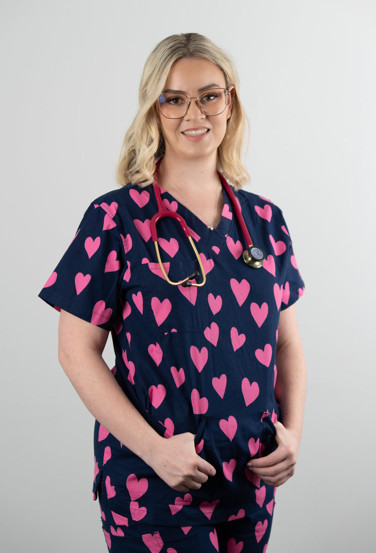 Boutique Caring clinical team member in scrubs